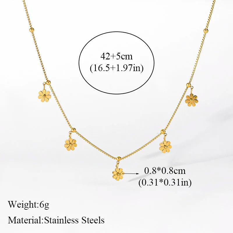 A stainless steel gold-colored flower and heart love necklace and earrings set