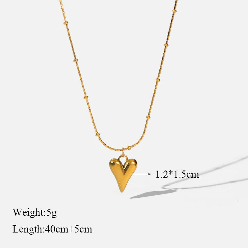 A stainless steel gold-colored flower and heart love necklace and earrings set