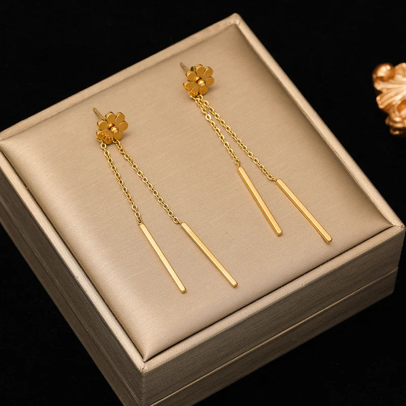 A stainless steel gold-colored flower and heart love necklace and earrings set